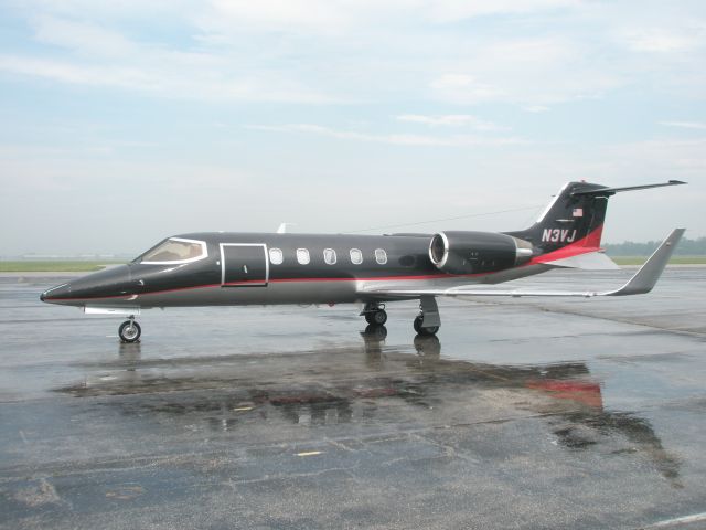 Learjet 31 (N3VJ) - Sitting on the ramp at Willow Run just after a morning shower.