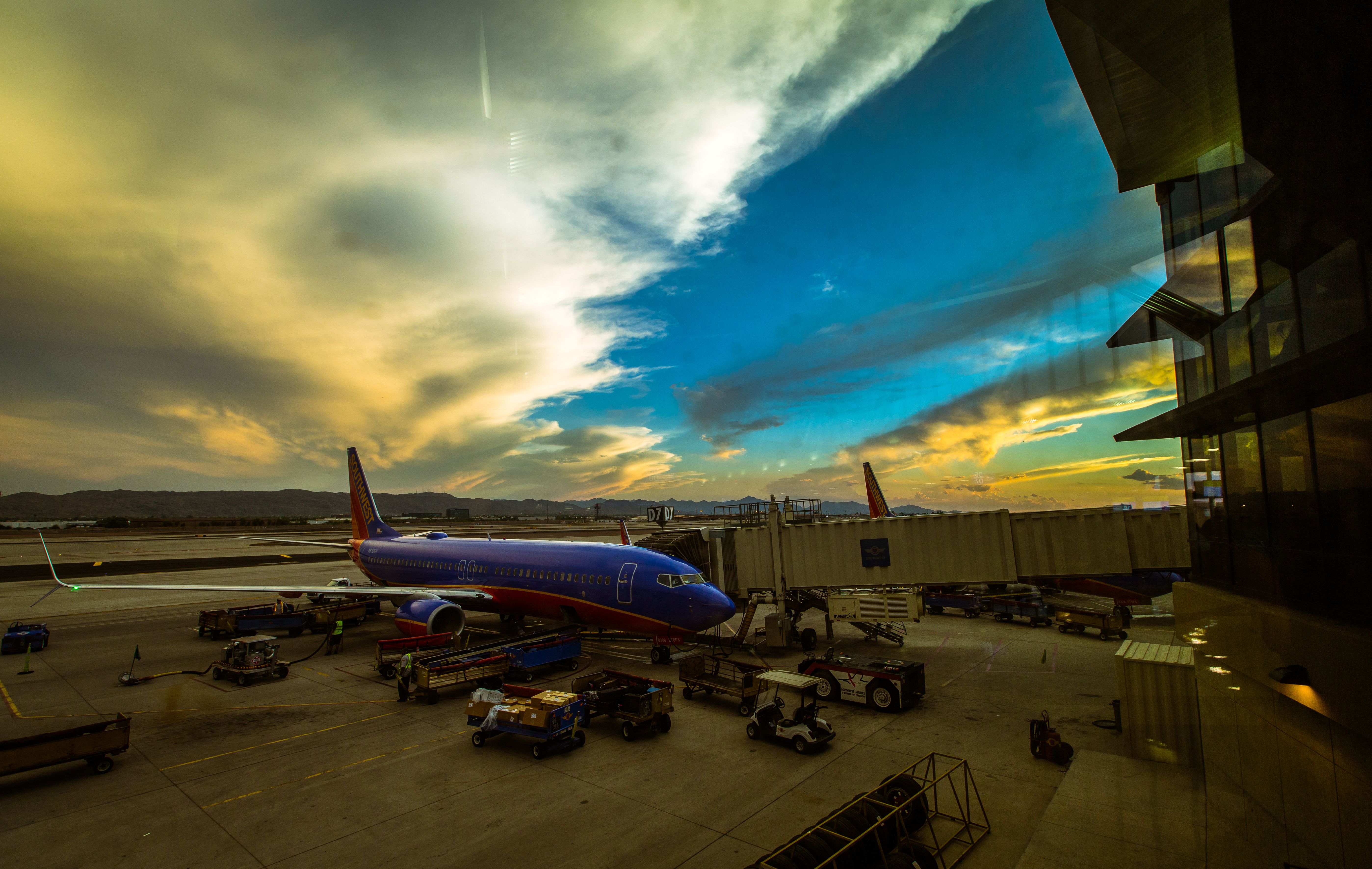 Boeing 737-700 (N8306H) - Standing at the end of the terminal D, beautiful sunset on 14 August 2014