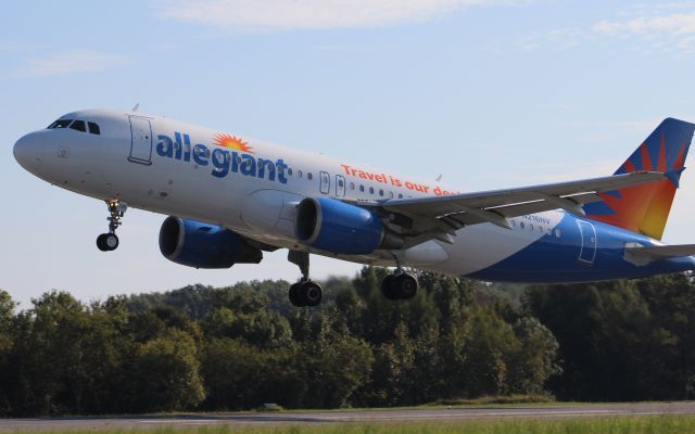 Airbus A320 (N216NV) - An Allegiant Air Airbus A320-214 departing Northwest Alabama Regional Airport via Runway 29 - September 14, 2018. This aircraft was carrying the University of North Alabama Lion football team to play North Dakota State. I used the 75-300mm lens and was a little too close to the takeoff to get the entire aircraft in the frame.