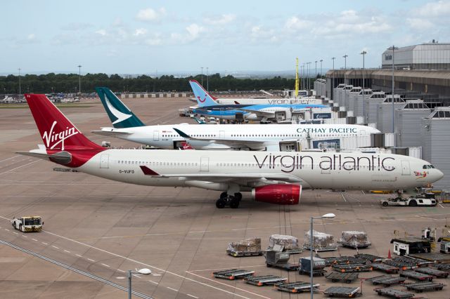 Airbus A330-300 (G-VUFO) - A view along terminal 2 with G-VUFO, soon to leave as VIR127 to JFK alongside the recently delivered B-LRN soon to return to Hong Kong as CPA358.