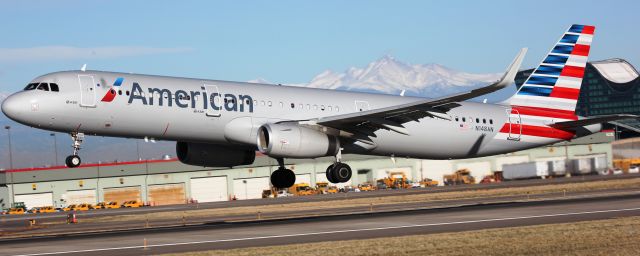 Airbus A321 (N148AN) - Departing 17R. Longs Peak in the background.