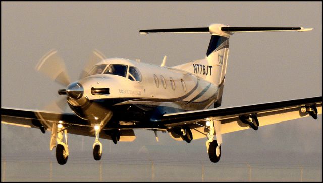 Pilatus PC-12 (N776JT) - Over the threshold at the Merced Regional Airport (KMCE)