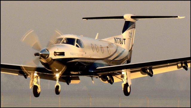 Pilatus PC-12 (N776JT) - Over the threshold at the Merced Regional Airport (KMCE)