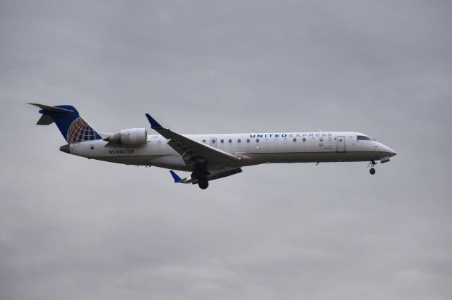 Canadair Regional Jet CRJ-700 (N530GJ) - N530GJ landing on runway 27R captured from Target parking lot.