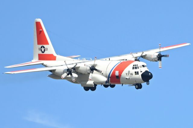 Lockheed C-130 Hercules (N1716) - I caught this Coast Guard C-130 turning final for runway 22 at Leesburg (FL).  I was standing in my front yard which is about one mile from the end of runway 22.