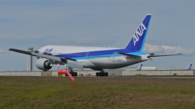 Boeing 777-200 (JA745A) - BOE595 lands on runway 34L to complete a flight test on 6/15/13. (LN:1112 cn 40904).