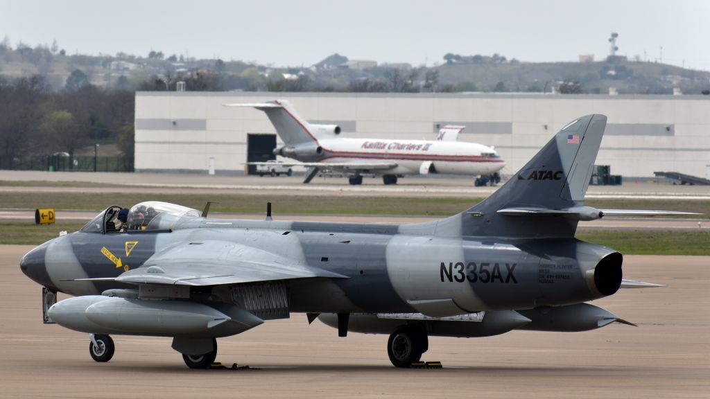 Hawker Hunter (N335AX) - Hawker Hunter Mk. 58, ex Swiss Air Force J-4091, now operated by ATAC, rolling out at Alliance.br /Bonus Kalitta Charters Boeing 727 in the background.