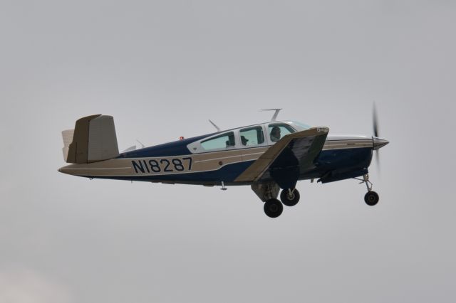 Beechcraft 35 Bonanza (N18287) - N18287 departing Runway 25 at TOL, 5/16/19.