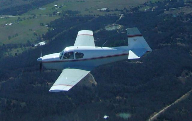 Mooney M-20 (N6030X) - 1960 Mooney M20A N6030X in flight near Gainesville, Texas