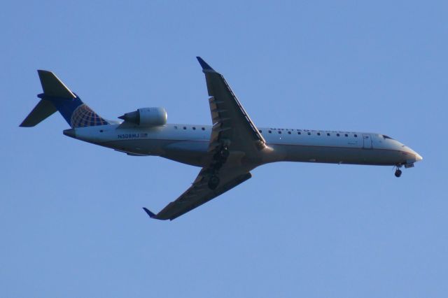 Canadair Regional Jet CRJ-700 (N508MJ) - Taken from Maine State Pier, Portland, ME; landing at KPWM from KIAD.