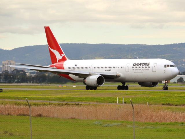 BOEING 767-300 (VH-ZXC) - On taxi-way heading for take off on runway 05, for flight to Sydney. Thursday 12th July 2012.
