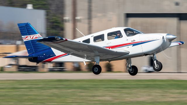 Piper Cherokee (N164G) - N164G lifting off of Martin State Airport's runway 15 while doing pattern work 