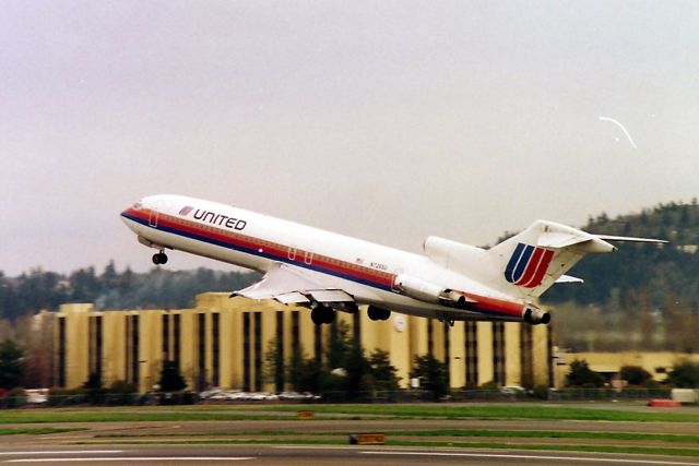 BOEING 727-200 (N7265U) - KPDX - UAL 727 departing PDX for DEN in this early 1990 s photo. This taken from the old East Marine Dr where one could park all day if you wanted to watch jets up close - with the Columbia River directly behind me and down the other side of the road. A really great viewing area - gone as usual.