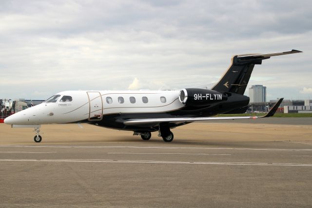 Embraer Phenom 300 (9H-FLYIN) - TAG Aviation Malta Phenom 300 taxiing onto Stand 454 on 24-Apr-24 arriving from ENHD as TEU7.