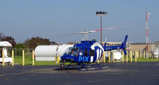 Bell JetRanger (N11TV) - LINDEN AIRPORT-LINDEN, NEW JERSEY, USA-AUGUST 29, 2018: A news helicopter for one of the local New York City T.V. stations is pictured just after refueling.