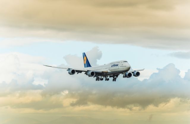 Boeing 747-200 (D-ABYN) - On a final approach at 16R during sunset