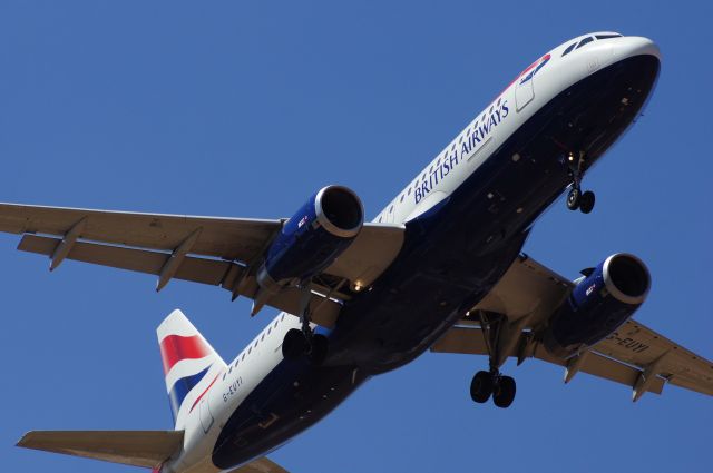 Airbus A320 (G-EUYI) - British Airways A320 a few ft before touching down.Great experience with jet blast