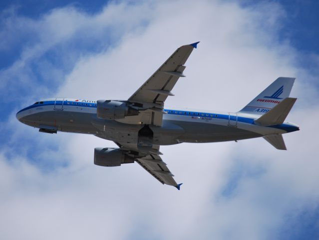 Airbus A319 (N744P) - Departing runway 18C - 12/10/14