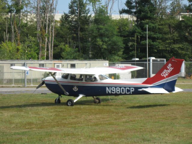 Cessna Skyhawk (N980CP) - Sitting on the grass at KFIT.