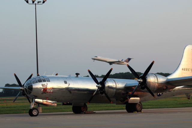 Boeing B-29 Superfortress (N69972) - Doc at Sunrise with the morning United Airline departure speeding to Chicago..............