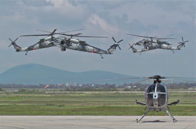 FAM1069 — - Some Mexican Air Force's UH-60M Black Hawk perform an "air ballet" over an MD-530F in Santa Lucia air show in 2017