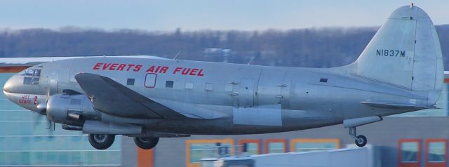 — — - C-46 you can almost see inside of the cockpit as she contiues climbing out.