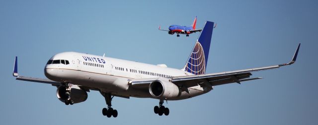 Boeing 757-200 (N19117) - Landing on 16L. Southwest 737 behind it is landing on 16R.