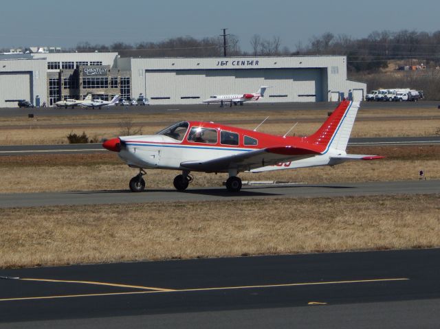 Piper Cherokee (N41209) - N41209, A 1974 Piper Cherokee, taxis to the ramp at Manassas Reginal Airport.