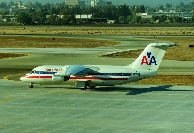 British Aerospace BAe-146-200 (N697A) - KSJC - Delivered new to AirCal as N145AC, this BAe-146 was taken in the American/AirCal merger days of the late 1980s. CN:2055 LN:55br /Type Bae 146-200. This jet flew with many different airlines and the last Reg was D-AMGL. Shown here about Summer 1990 on taxi to 30L for departure to So California.