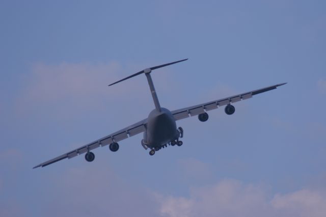 — — - C-5 Retracts Gear at Twilight WPAFB