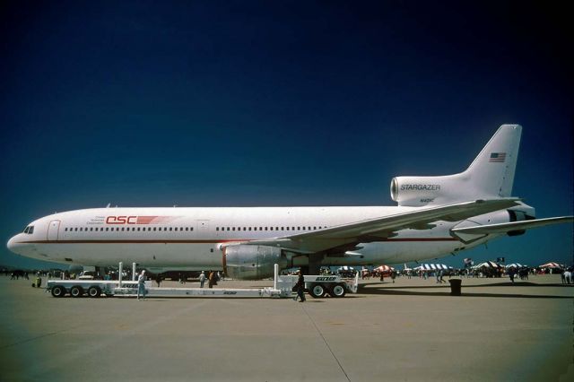 Lockheed L-1011 TriStar (N140SC) - Lockheed L-1011 N140SC Stargazer was displayed at the Vandenberg AFB Open House on April 9, 1995, just six days after it first launched a Pegasus booster. The white trailer is used to transport the Pegasus booster and to load it onto the Stargazer.