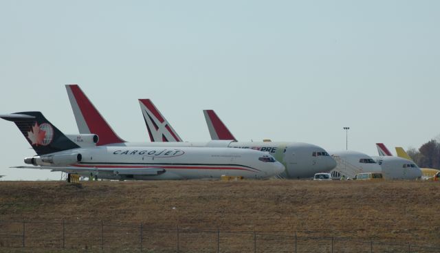 — — - just a shot of 1 of the rows on the DHL ramp on a late Sunday morning, near to far side is a 727 followed by 3 ABX 767s