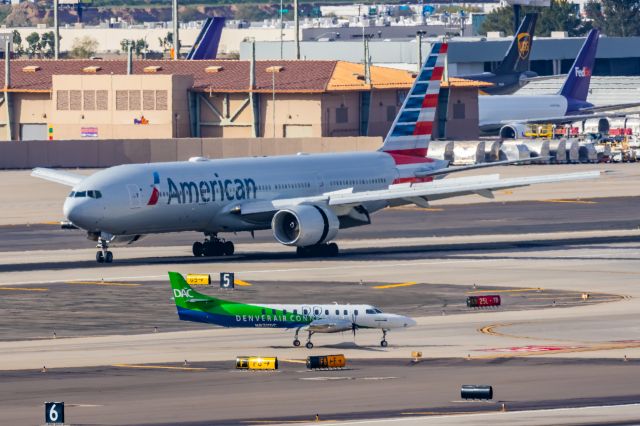 Boeing 777-200 (N779AN) - An American Airlines 777-200 landing at PHX on 2/13/23, the busiest day in PHX history, during the Super Bowl rush. Taken with a Canon R7 and Canon EF 100-400 II L lens.