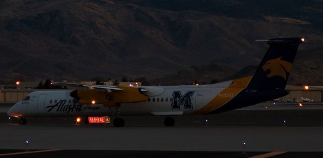 de Havilland Dash 8-400 (N403QX) - QXEs N403QX, a Dash 8 dressed in Montana State University Bobcats collegiate clothing, taxies toward runway 16R for an evening departure from Reno Tahoe International.