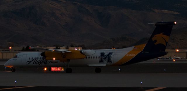 de Havilland Dash 8-400 (N403QX) - QXEs N403QX, a Dash 8 dressed in Montana State University Bobcats collegiate clothing, taxies toward runway 16R for an evening departure from Reno Tahoe International.