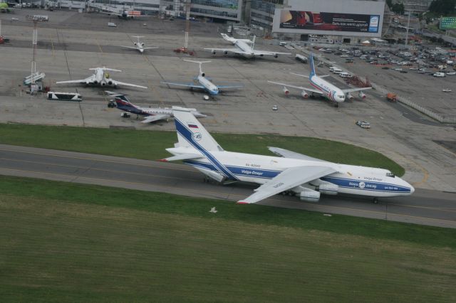 Antonov An-124 Ruslan (RA-82042) - AN-124 loading at DME in Moscow.  Some other aircraft in the background