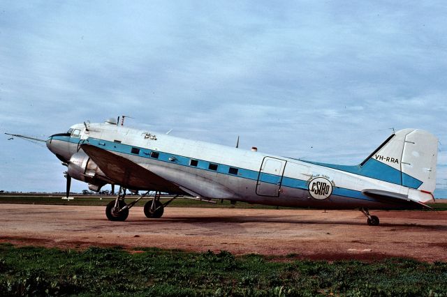 Douglas DC-3 (VH-RRA) - Nice study of CSIRO operated cloud seeding DC-3 taken in late 1975 by Tony Arbon - location not recorded but possibly western NSW. The history of this aircraft is:br /br /21/4/45                Delivered to USAF as 44-76767br /6/5/45                   Diverted to 35 Sqn RAAF as A65-97 using call sign VHRFNbr /                                To 36 Sqnbr /                                To 86 Wingbr /                                To 91 Wing – Japanbr /                                To Transport Flight –Japanbr /                                To ARDU Edinburgh SAbr /29/12/64              To CSIRObr /29/10/65              VH-RPA reserved but not taken upbr /29/10/65              VH-RRA CSIRO Division of Cloud Physicsbr /20/7/78                Wfu at Mascot NSWbr /7/3/79                   Cancelled