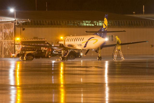 Fairchild Dornier SA-227DC Metro (VH-SWK) - Sharp Airlines (VH-SWK) Fairchild Swearingen SA-227DC Metro 23 at a very wet Wagga Wagga Airport.