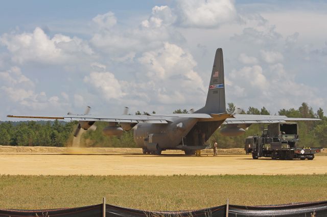 Lockheed C-130 Hercules (89-9106) - A USAF Lockheed C-130, 89-9106, cn 382-4852, from the 910th Airlift Wing (AW), Youngstown, OH (Air Force Reserve Command) at Fort McCoy/Young Tactical Landing Site-Air Assault Strip, Ft. McCoy, (WS20) USA – WI, during Warrior Exercise 86-13-01 (WAREX) on 17 Jul 2013. The power of the Allison T56-A-15 turboprop is evident as it creates a vortice of dust in the #1 engine.