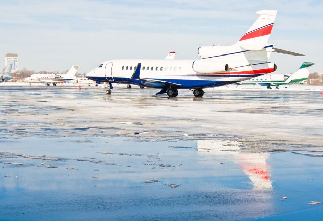 Dassault Falcon 7X (VH-MQK) - The Dassault Falcon 7X reflecting it's strength @ KBOS Logan Airport on FlightAware.Com !