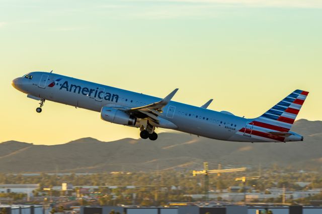 Airbus A321 (N909AM) - American Airlines A321 taking off from PHX on 11/9/22. Taken with a Canon R7 and Tamron 70-200 G2 lens.