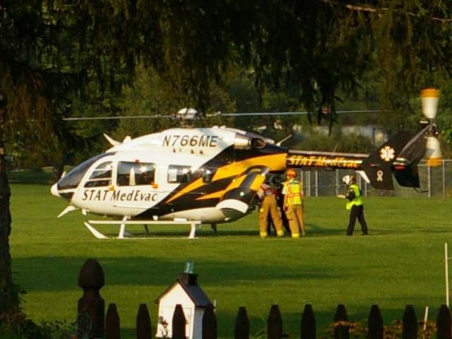 KAWASAKI EC-145 (N766ME) - Patient being loaded for transport to trauma center.