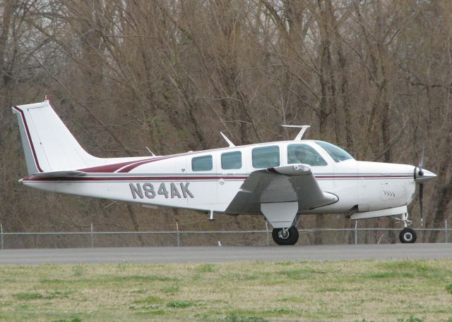 Beechcraft 35 Bonanza (N84AK) - Starting to roll down runway 14 at the Shreveport Downtown airport.