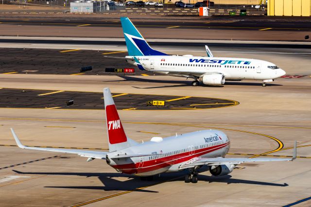 Boeing 737-800 (N915NN) - American Airlines 737-800 in TWA retro livery taxiing at PHX on 12/16/22. Taken with a Canon R7 and Tamron 70-200 G2 lens.