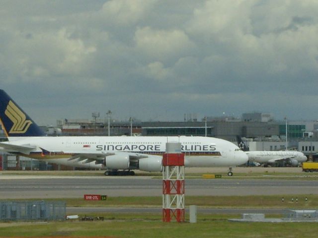 Airbus A380-800 — - A Singapore A380-800 passes a Star Alliance Lufthansa A320