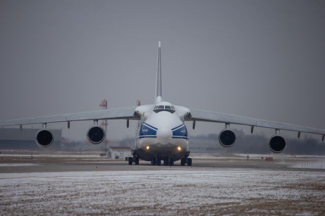 Antonov An-12 (RA-82046) - VDA5568 returning to the cargo pad after having a issue with its #3 engine.