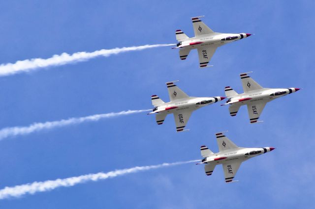 — — - The U.S. Thunderbirds do a diamond roll at Robins AFB.