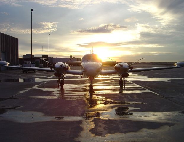 — — - Piper Cheyenne at sunset at the University of North Dakota.