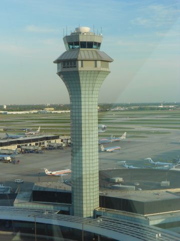 — — - View of OHare control tower from ground operations tower.