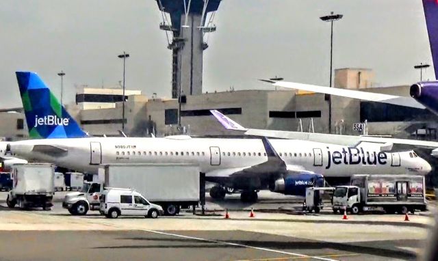 Airbus A321 (N980JT) - “Take a menta health day” is boarding passengers heading to JFK.